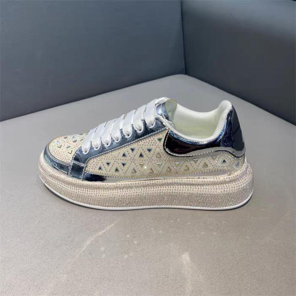 Luxury sneakers adorned with triangular rhinestones
